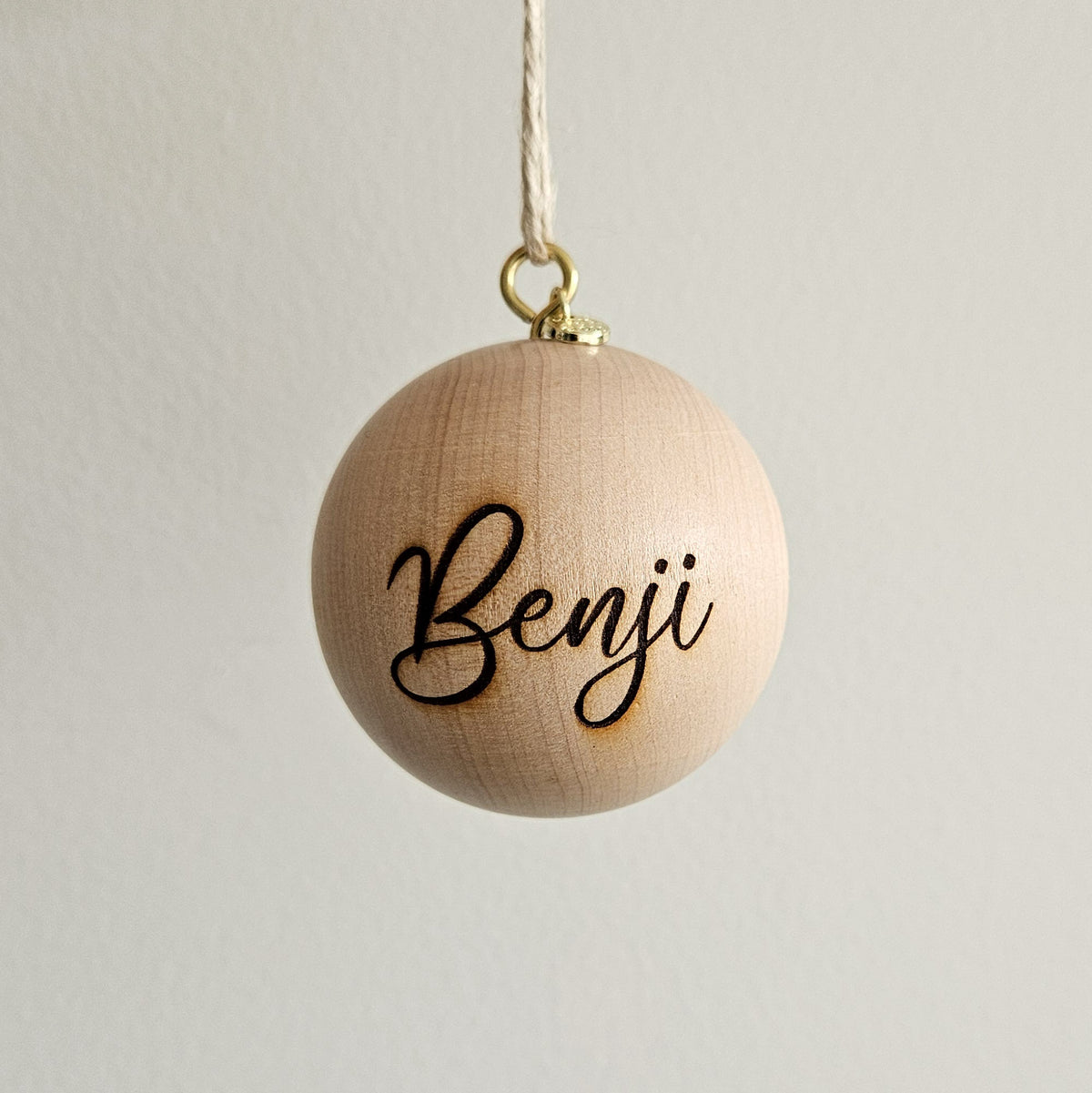 6cm personalised wooden bauble without a bow and engraved name Benji