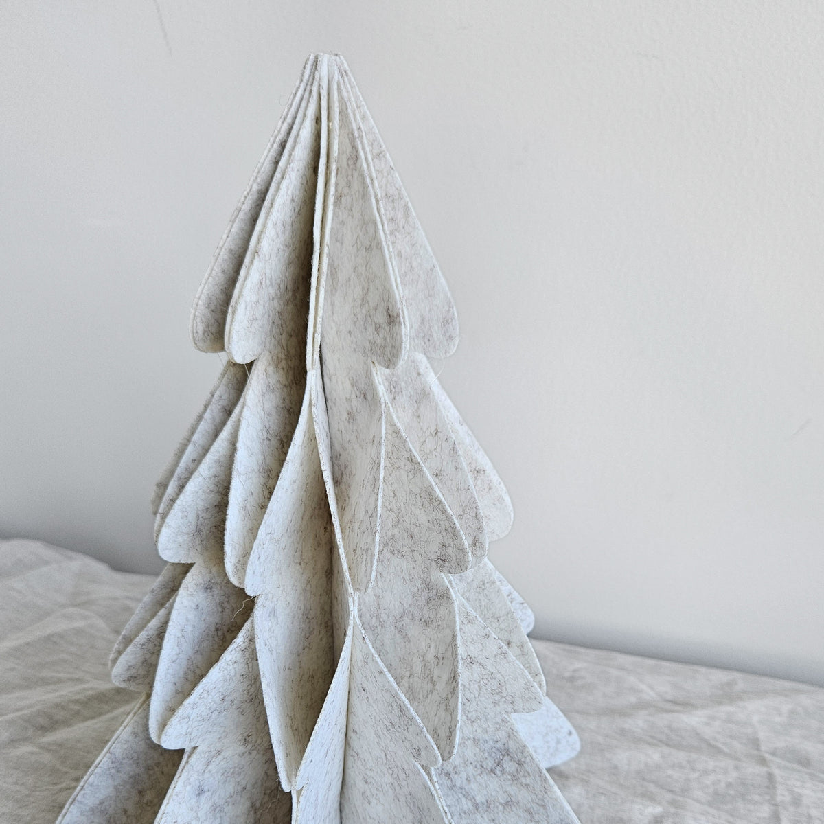 Close-up of the soft ivory felt tabletop Christmas tree