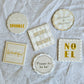 Set of six Merry Sparkle ceramic Christmas coasters in ivory, taupe, white, gold and silver